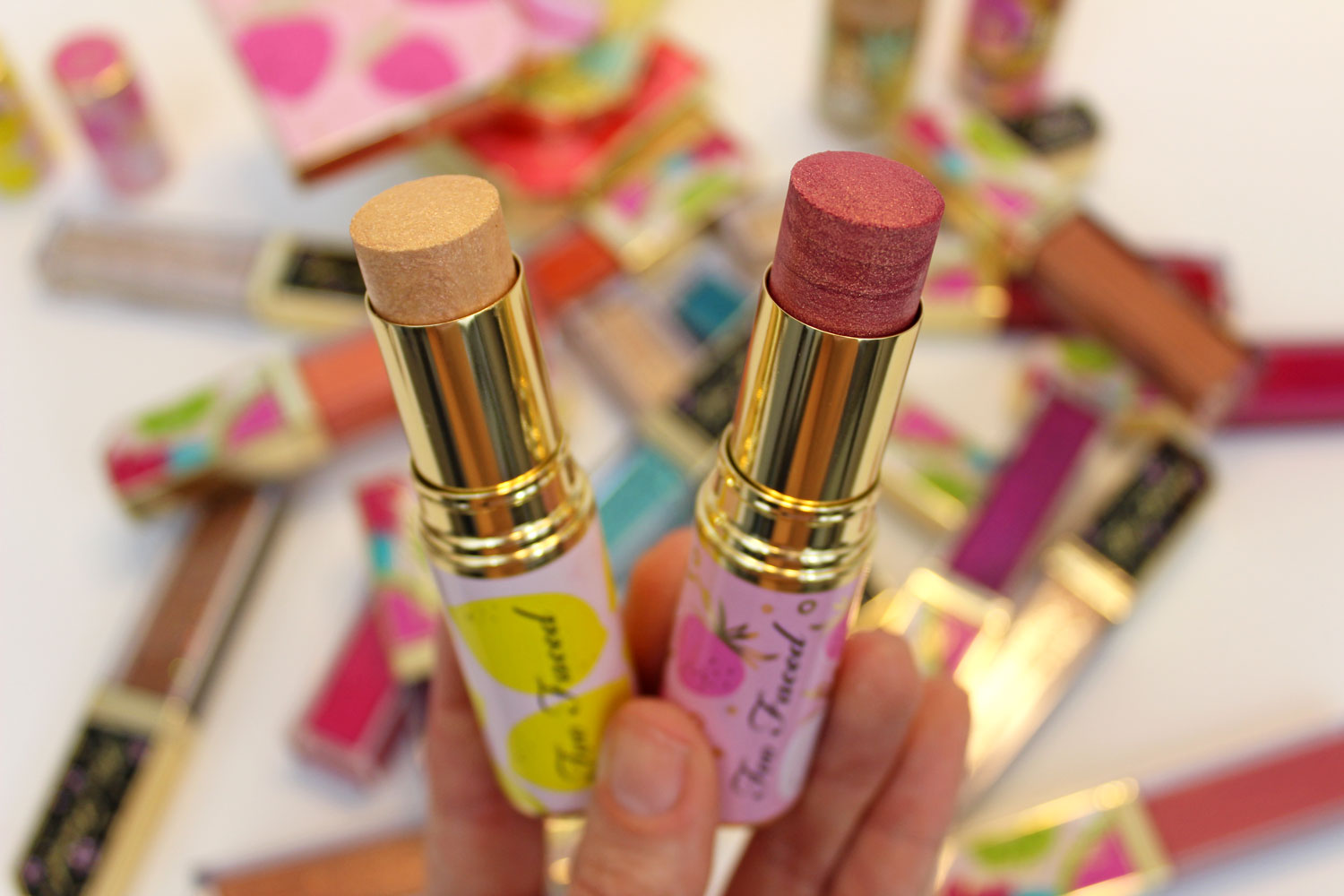 Too Faced Tutti Frutti Frosted Fruits Highlighter Sticks review and swatches by cruelty free blog My Beauty Bunny