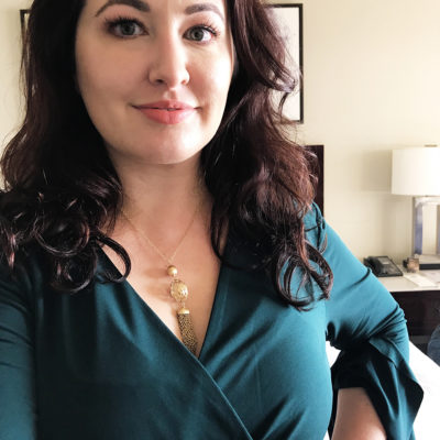 How to dress for a vlogger conference - green wrap dress and Ben Bridge gold tassel necklace