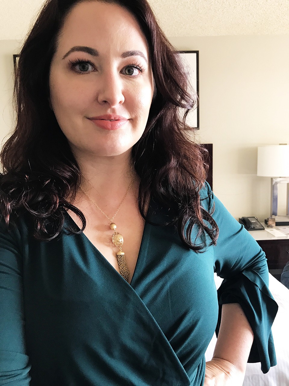 How to dress for a vlogger conference - green wrap dress and Ben Bridge gold tassel necklace